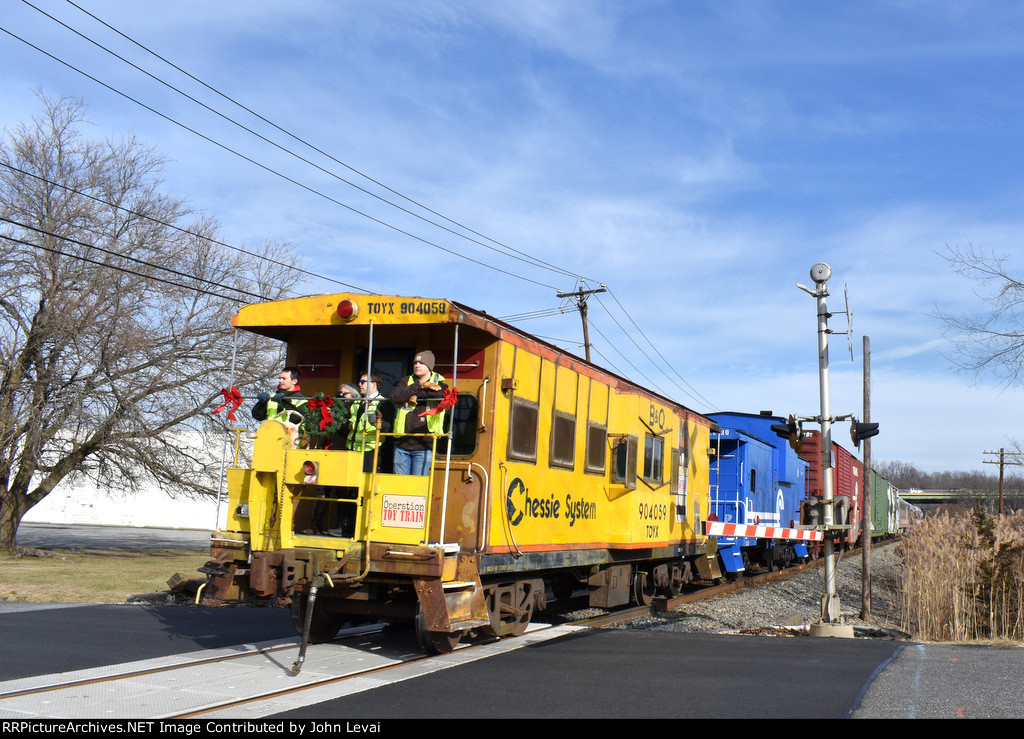 The Chessie System and Conrail Caboose on the back of the train-picture taken from Leone Rd Grade Crossing 